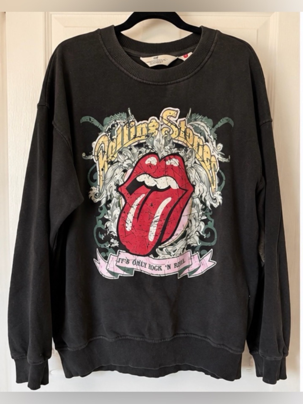 H&M Black Crewneck Sweatshirt with Red Tongue Graphic and Yellow Accents